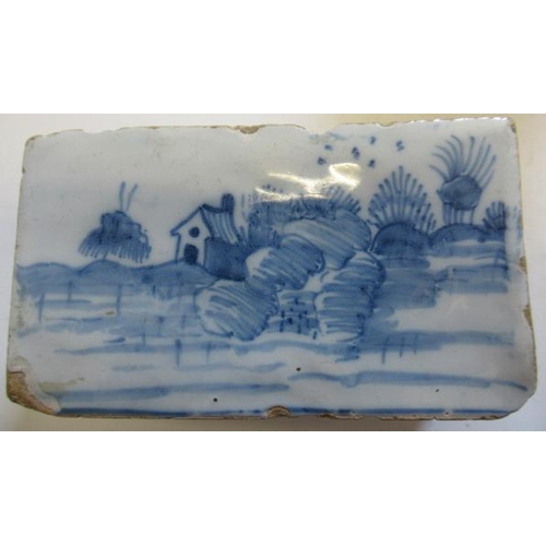 34 - AN ENGLISH DELFT FLOWER BRICK, c.1760, possibly Liverpool, of plain oblong form with eighteen pierce... 