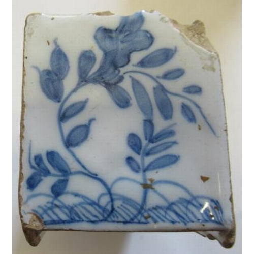 34 - AN ENGLISH DELFT FLOWER BRICK, c.1760, possibly Liverpool, of plain oblong form with eighteen pierce... 