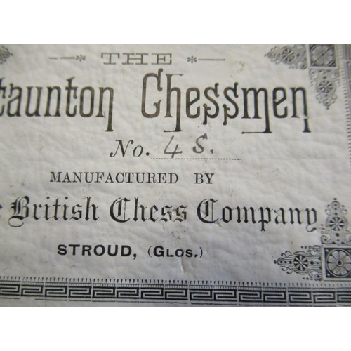 560 - A BOX AND EBONY STAUNTON PATTERN CHESS SET, one white and one black rook and knight with red crown, ... 