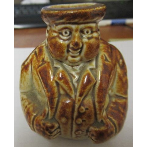 43 - A VICTORIAN STONEWARE NOVELTY INKWELL modelled as Mr Pickwick with a quill hole to each shoulder, th... 