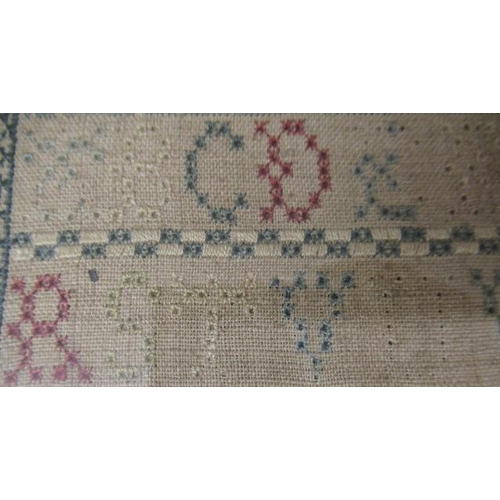 562 - A GEORGE II LONG SAMPLER,1743, worked in coloured silks on a fine linen ground in full, half and oth... 