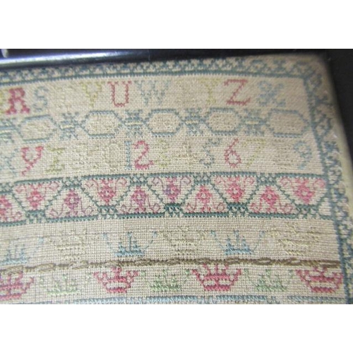 562 - A GEORGE II LONG SAMPLER,1743, worked in coloured silks on a fine linen ground in full, half and oth... 