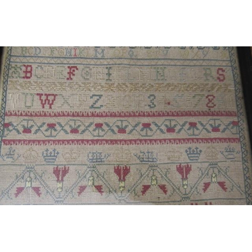 562 - A GEORGE II LONG SAMPLER,1743, worked in coloured silks on a fine linen ground in full, half and oth... 