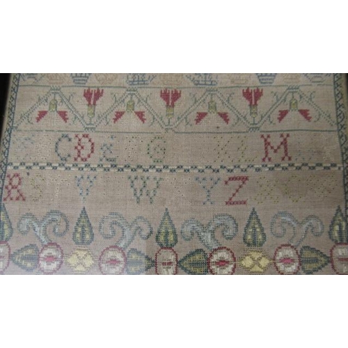 562 - A GEORGE II LONG SAMPLER,1743, worked in coloured silks on a fine linen ground in full, half and oth... 