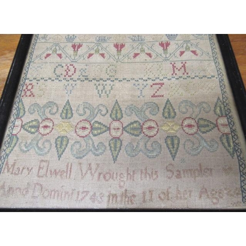 562 - A GEORGE II LONG SAMPLER,1743, worked in coloured silks on a fine linen ground in full, half and oth... 