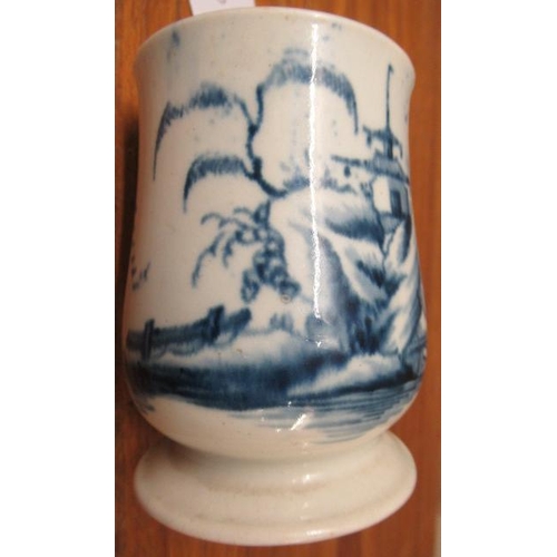 64 - A JAMES PENNINGTON PORCELAIN SMALL MUG, 1763-71, painted in underglaze blue with a fisherman standin... 