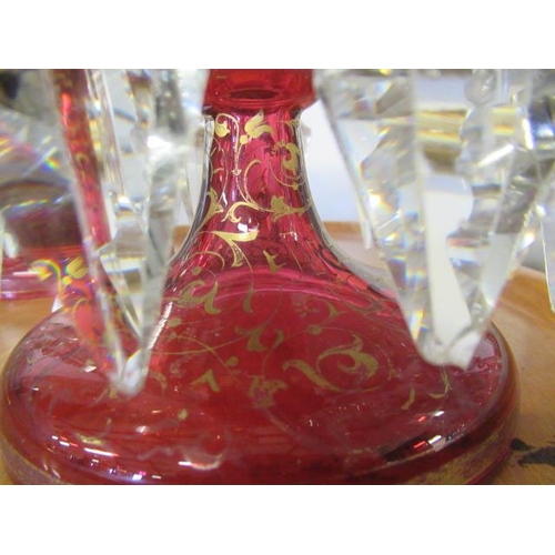 143 - A PAIR OF LATE 19TH CENTURY CRANBERRY GLASS LUSTRES, of typical form, the everted fold over rims ove... 