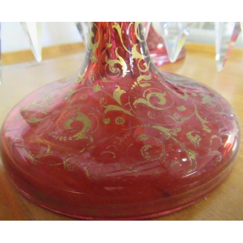 143 - A PAIR OF LATE 19TH CENTURY CRANBERRY GLASS LUSTRES, of typical form, the everted fold over rims ove... 