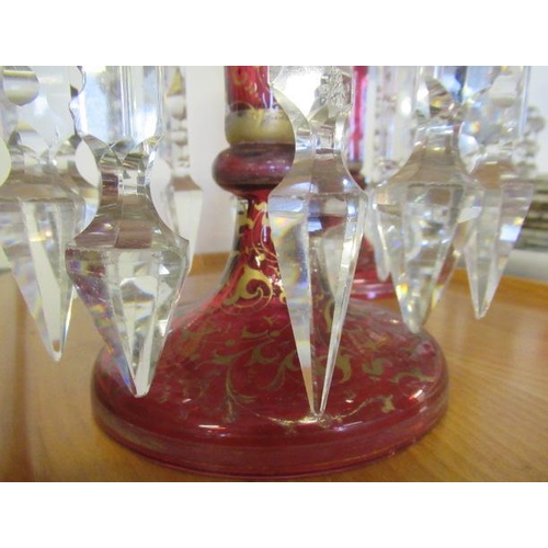 143 - A PAIR OF LATE 19TH CENTURY CRANBERRY GLASS LUSTRES, of typical form, the everted fold over rims ove... 