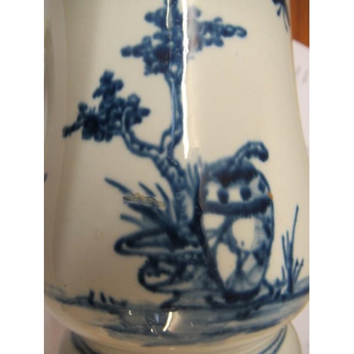 63 - A VAUXHALL PORCELAIN MUG, 1755-60, of baluster form painted in underglaze blue with a small child st... 