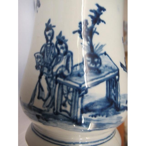 63 - A VAUXHALL PORCELAIN MUG, 1755-60, of baluster form painted in underglaze blue with a small child st... 