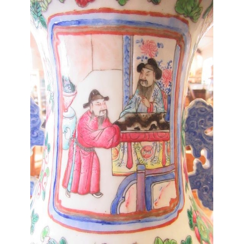 1 - A CANTONESE PORCELAIN FAMILLE ROSE TWO HANDLED ROULEAU VASE painted with two panels of court dignita... 