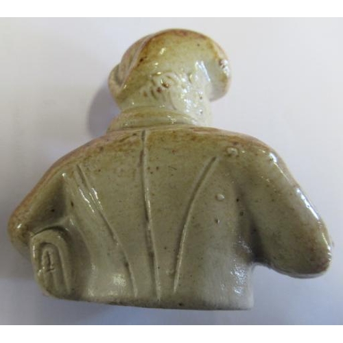 43 - A VICTORIAN STONEWARE NOVELTY INKWELL modelled as Mr Pickwick with a quill hole to each shoulder, th... 