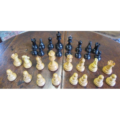 560 - A BOX AND EBONY STAUNTON PATTERN CHESS SET, one white and one black rook and knight with red crown, ... 