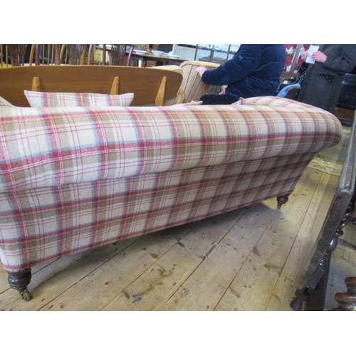 830 - A VICTORIAN WALNUT FRAMED CHESTERFIELD SOFA, upholstered in wool tartan, raised on turned legs with ... 