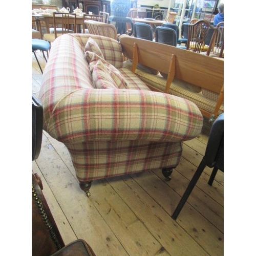 830 - A VICTORIAN WALNUT FRAMED CHESTERFIELD SOFA, upholstered in wool tartan, raised on turned legs with ... 