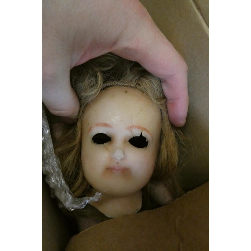 105 - A quantity of bisque, wax and composition doll parts, including an AM 370 9 DEP shoulder head, an AM... 