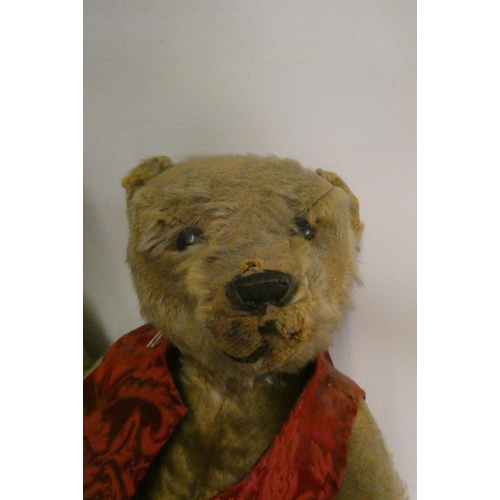 113 - Two old straw filled teddies, comprising a 20