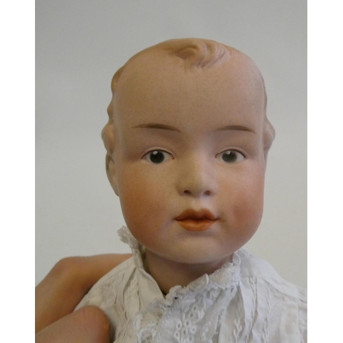 14 - A Gebruder Heubach bisque socket head boy doll, with moulded eyes, moulded hair, closed mouth, wood ... 