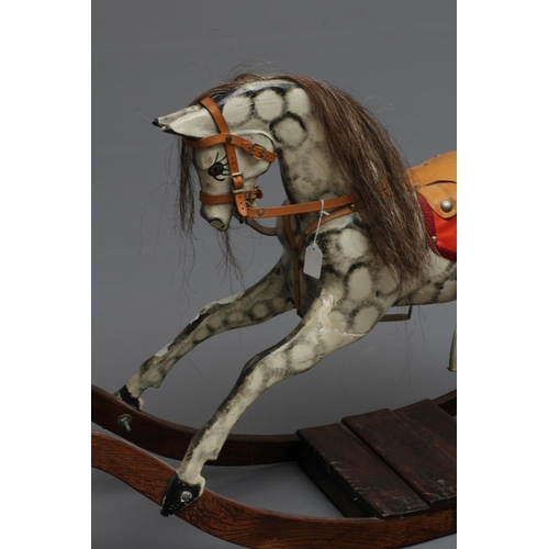 150 - Vintage rocking horse, wooden body, glass eyes, dappled grey paint, horse hair mane and tail, leathe... 