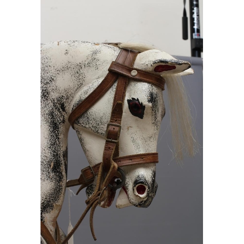 153 - A G & J Lines rocking horse, late 19th century, of carved wood construction painted in dappled grey,... 