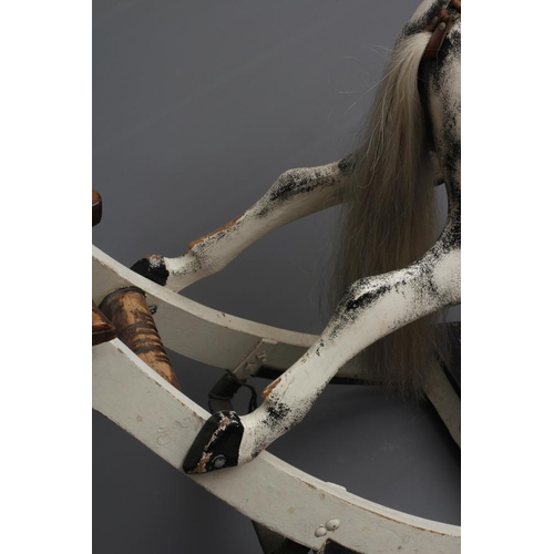 153 - A G & J Lines rocking horse, late 19th century, of carved wood construction painted in dappled grey,... 