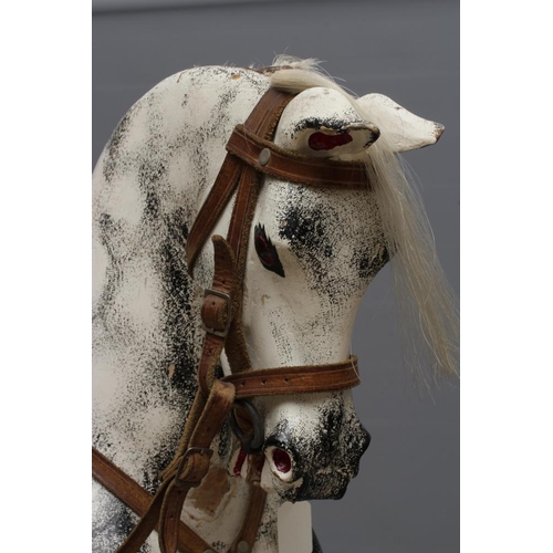 153 - A G & J Lines rocking horse, late 19th century, of carved wood construction painted in dappled grey,... 