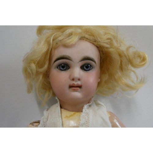 19 - A French bisque socket head girl doll, with blue glass fixed eyes, moulded closed mouth, pierced ear... 