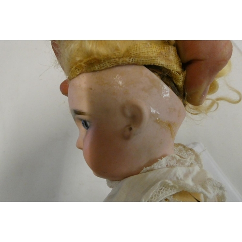 19 - A French bisque socket head girl doll, with blue glass fixed eyes, moulded closed mouth, pierced ear... 