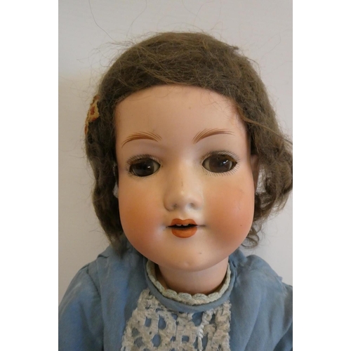 2 - An Armand Marseille bisque socket head doll, with brown glass sleeping eyes, open mouth, teeth, wood... 