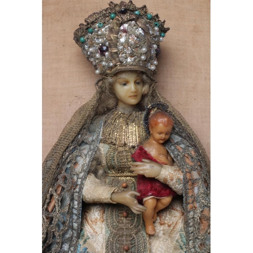 22 - A wax Virgin & Child, 19th century, with finely moulded wax head, painted features, blue eyes, blond... 