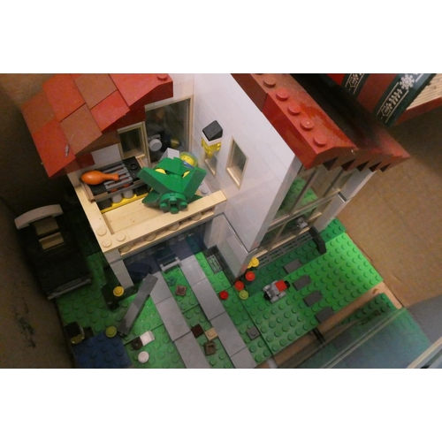 234 - Two boxes of built Lego buildings, unchecked for completeness