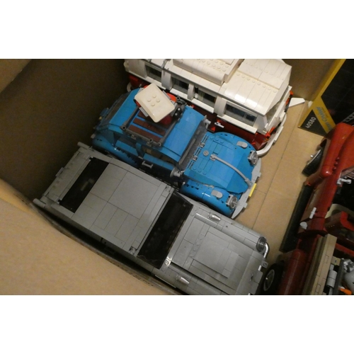 235 - Two boxes of built Lego vehicles, together with an unopened set 40580, unchecked for completeness