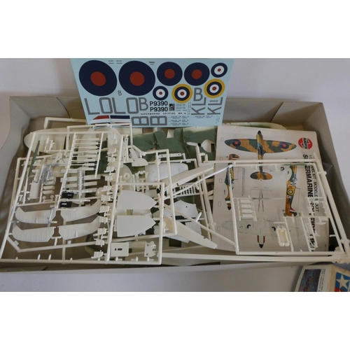 258 - Two plastic aircraft kits comprising Airfix 1/24th scale Spitfire (started) and Tamiya 1/48 scale Av... 