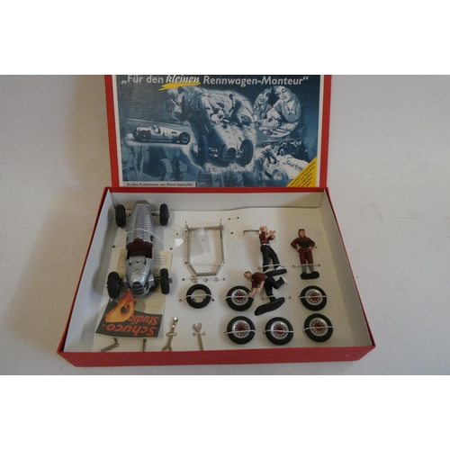 323 - Three Schuco Late issue racing cars comprising Bugatti, Auto Union and Mercedes, all items boxed, ex... 