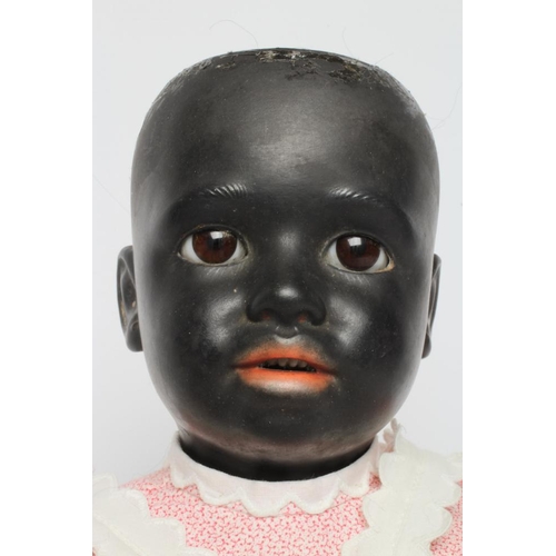 40 - A rare Simon & Halbig bisque socket head girl doll, with brown glass sleeping eyes, open mouth, teet... 