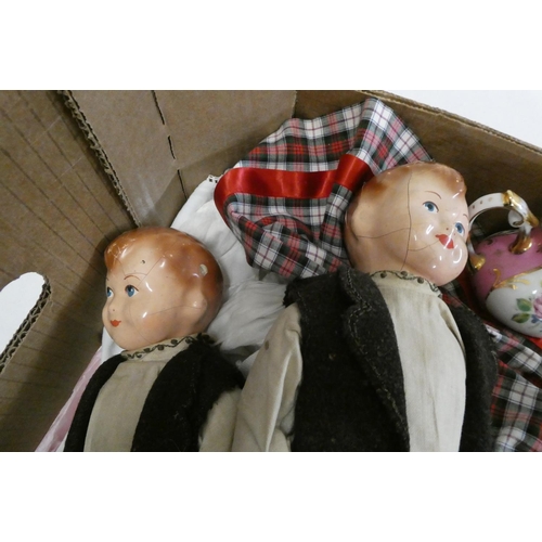 42 - A box of dolls, clothing and accessories, including a pair of vintage composition head boys, a minia... 