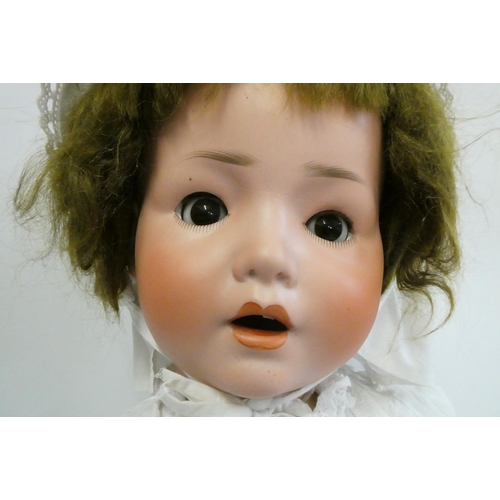 44 - A Schoenau & Hoffmeister bisque socket head doll, brown glass sleeping eyes, open mouth, composition... 