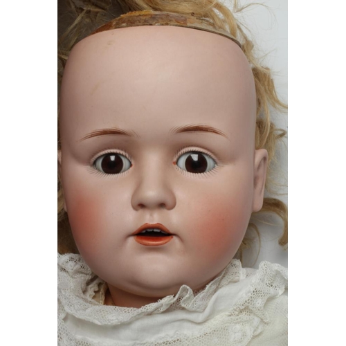 46 - A J. D. Kestner bisque socket head doll, with brown glass sleeping eyes, open mouth, applied teeth, ... 