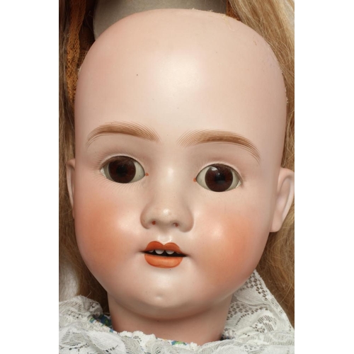 48 - A large Schoenau & Hoffmeister bisque socket head doll, with brown glass sleeping eyes, oepn mouth, ... 