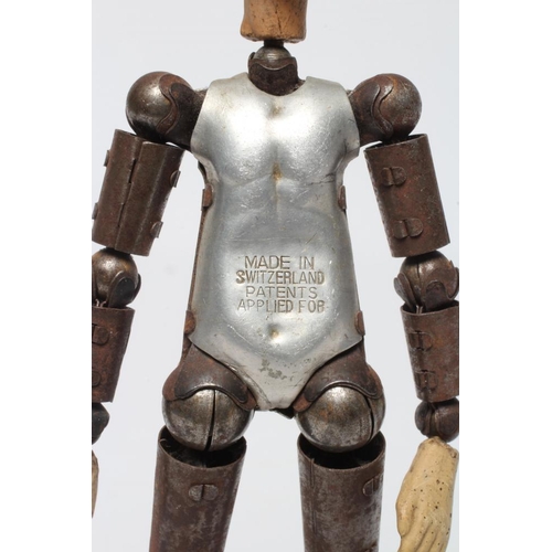 5 - Bucherer Acrobatic Doll, with metal articulated body stamped 