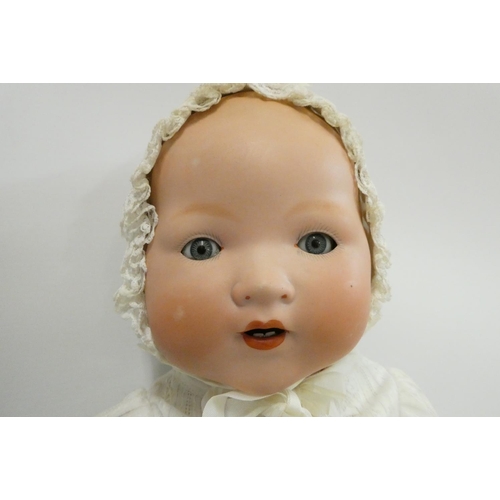 50 - An Armand Marseille bisque socket head baby doll, with blue glass sleeping eyes, open mouth, teeth, ... 