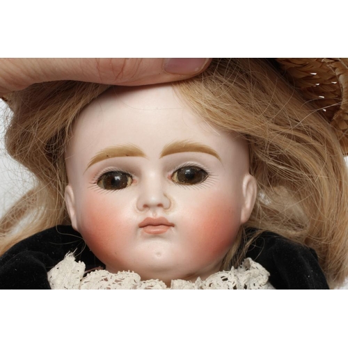 6 - A Belton type bisque shoulder head doll, with brown glass eyes, closed mouth, blond wig, kid body, b... 