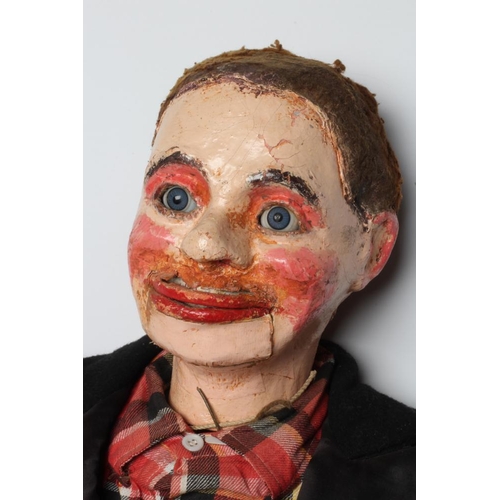 62 - A ventriloquist dummy, circa 1930s, the papier mache head with blue glass eyes with sideways glancin... 