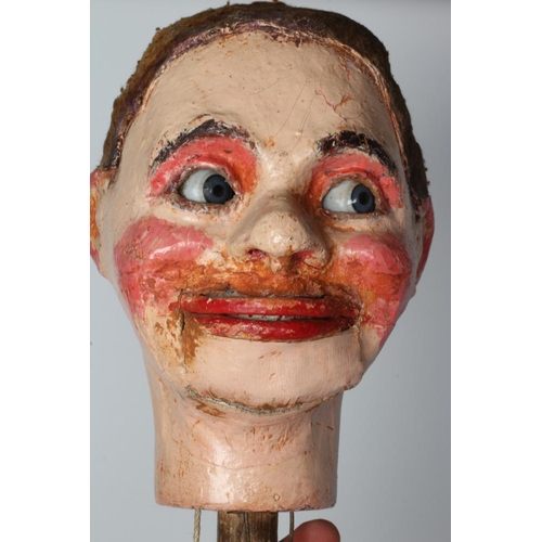 62 - A ventriloquist dummy, circa 1930s, the papier mache head with blue glass eyes with sideways glancin... 