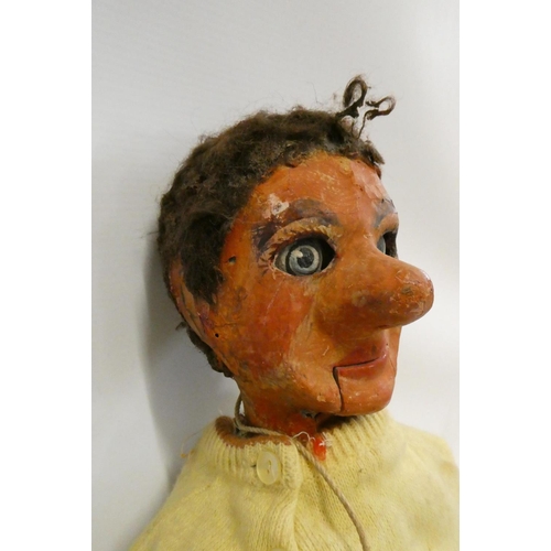 63 - A vintage ventriloquist dummy, with papier mache head, painted wood eyes with sideways glancing pull... 