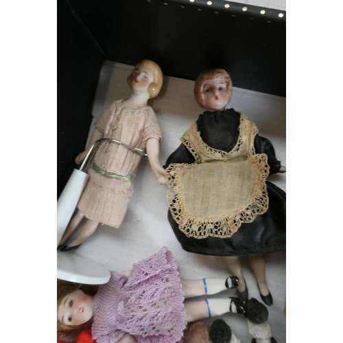 71 - A small collection of dolls house dolls including antique bisque examples, Victorian china busts and... 