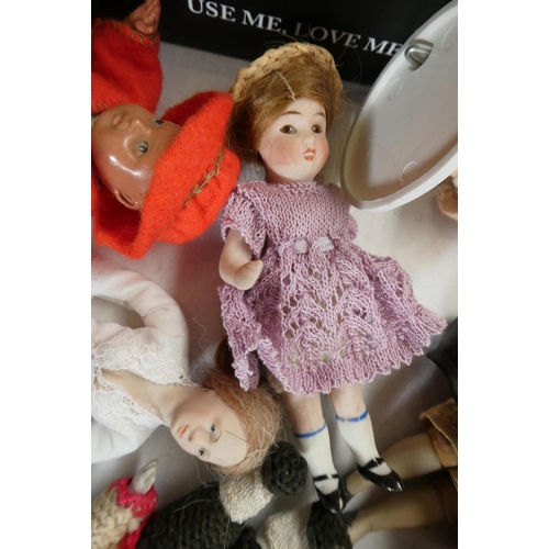 71 - A small collection of dolls house dolls including antique bisque examples, Victorian china busts and... 