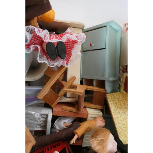 82 - A box of dolls house furniture, dolls and accessories, including a large model telephone box, rugs a... 