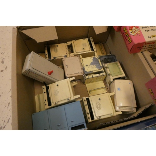 85 - Three boxes of mainly vintage dolls house furniture and accessories, including tin kitchen equipment... 